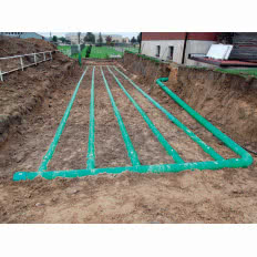 Gruntowy wymiennik ciepła GLOBAL na zewnątrz domu jednorodzinnego