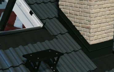 Zabezpieczenie komina przed deszczem i wiatrem