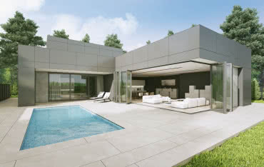 Salon otwarty na ogród – tarasowe drzwi przesuwne i harmonijkowe od Aluprof