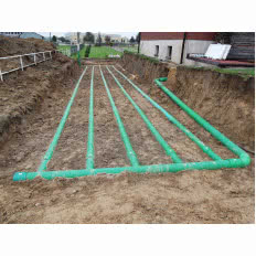 Gruntowy wymiennik ciepła GLOBAL na zewnątrz domu jednorodzinnego